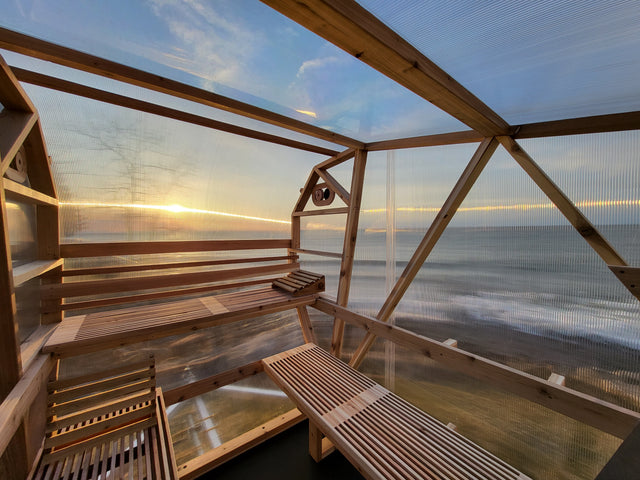 Interior view of NorthUp Curve XL. Views of sunlight and lakes through walls.