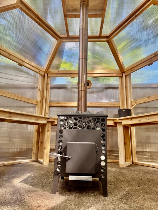 Interior view of Nippa stove and translucent panels inside NorthUp Hex sauna