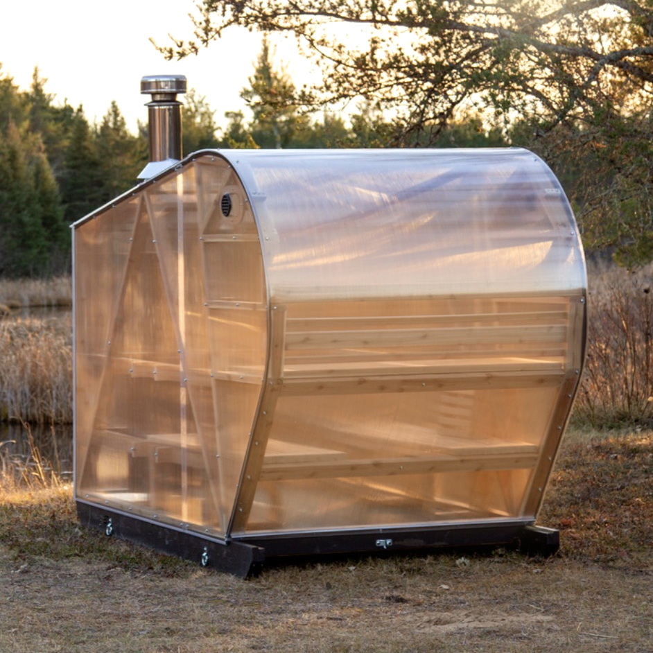 NorthUp XL exterior with sunlight beaming through transparent siding. Creekside.