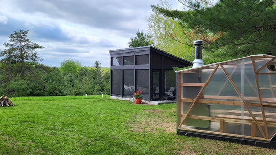 NorthUp XL parked on grassy area in front of a 4-season patio structure. 