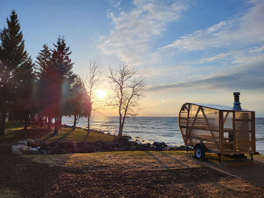 NorthUp XL Mobile Trailer parked in front of lake superior at sunset